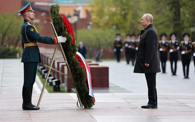 Russian President Vladimir Putin attends a wreath-laying ceremony at the Tomb of the Unknown Soldier after the military parade marking the 77th anniversary of the end of World War II in Moscow, Russia, May 9, 2022. (Anton Novoderezhkin, Sputnik, Kremlin Pool Photo via AP)