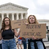 Abortion rights demonstrators rally, Saturday, May 14, 2022, outside the Supreme Court in Washington, during protests across the country. (AP Photo/Jacquelyn Martin)