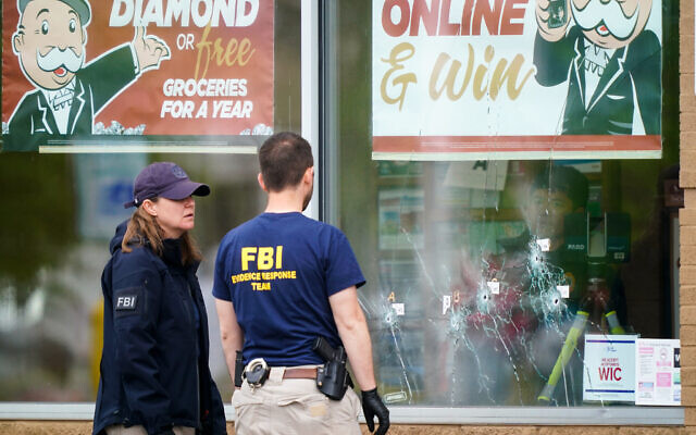 Investigators work the scene of a shooting at a supermarket, in Buffalo, NY, May 16, 2022. (AP Photo/Matt Rourke)