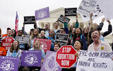 Demonstrators protest outside of the US Supreme Court, May 16, 2022, in Washington. (AP Photo/Mariam Zuhaib)