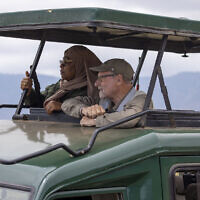 Tanzanian President Samia Suluhu Hassan (left) appears with journalist Peter Greenberg on a safari in Ngorongoro Crater in Tanzania for the television show “The Royal Tour.” (Karen Ballard via AP)