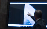 Deputy Director of Naval Intelligence Scott Bray points to a video display of a UAP during a hearing of the House Intelligence, Counterterrorism, Counterintelligence, and Counterproliferation Subcommittee hearing on 'Unidentified Aerial Phenomena,' on Capitol Hill, May 17, 2022, in Washington. (Alex Brandon/AP)