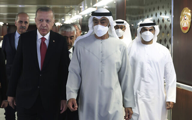 Turkish President Recep Tayyip Erdogan, left, and Sheikh Mohamed bin Zayed Al Nahyan, center, walk before a meeting in Abu Dhabi, United Arab Emirates, May 17, 2022. (Turkish Presidency via AP)
