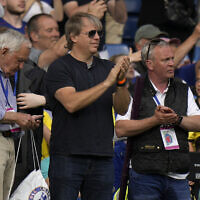 American businessman Todd Boehly (center) applauds as he attends the English Premier League soccer match between Chelsea and Watford at Stamford Bridge stadium in London, May 22, 2022. (AP/Alastair Grant)