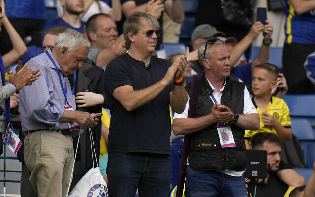 American businessman Todd Boehly (center) applauds as he attends the English Premier League soccer match between Chelsea and Watford at Stamford Bridge stadium in London, May 22, 2022. (AP/Alastair Grant)