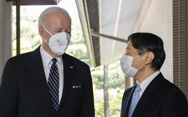 Japan's Emperor Naruhito, right, greets US President Joe Biden prior to a meeting at the Imperial Palace in Tokyo, May 23, 2022. (Saul Loeb/Pool Photo via AP)