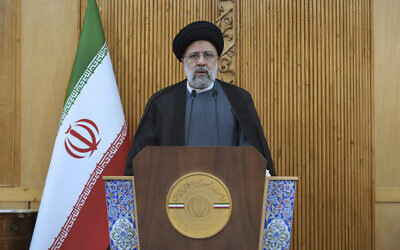 Iranian President Ebrahim Raisi speaks before departing Tehran's Mehrabad airport for a trip to Oman, May, 23, 2022. (AP Photo/Vahid Salemi)