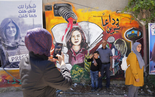 Palestinians visit the site where veteran Palestinian-American reporter Shireen Abu Akleh was shot and killed, in the West Bank city of Jenin, May 18, 2022. (AP/Majdi Mohammed)