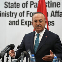 Turkish Foreign Minister Mevlut Cavusoglu speaks during a joint statement with his Palestinian counterpart Riad al-Malki in the West Bank city of Ramallah, May 24, 2022. (AP Photo/Majdi Mohammed)