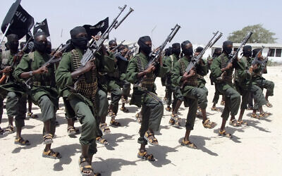 Hundreds of newly trained al-Shabab fighters perform military exercises in the Lafofe area some 18 km south of Mogadishu, in Somalia on February 17, 2011. (AP Photo/Farah Abdi Warsameh, File)