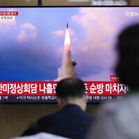 People watch a TV screen showing a news program reporting about North Korea's missile launch with file image, at a train station in Seoul, South Korea, May 25, 2022. (AP/Lee Jin-man)