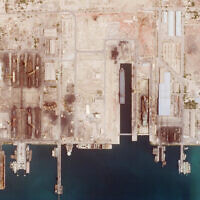 This satellite photo from Planet Labs PBC shows the Iranian Revolutionary Guard's newest ship, the Shahid Mahdavi, center right, under construction in a shipyard west of Bandar Abbas, Iran, May 21, 2022. (Planet Labs PBC via AP)