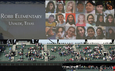 Photos of the victims of the shooting at Robb Elementary School in Uvalde, Texas, are shown on a video display at T-Mobile Park Friday, May 27, 2022, during a moment of silence before a baseball game between the Seattle Mariners and the Houston Astros in Seattle. (AP Photo/Ted S. Warren)