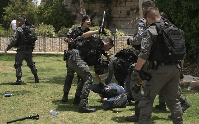 Israeli police officers detain a Palestinian near Damascus Gate outside Jerusalem's Old City, May 29, 2022. (AP Photo/Mahmoud Illean)