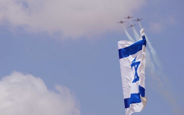 Israeli jets fly over the IAF museum at the Hatzerim Airbase in southern Israel on Independence Day, May 5, 2022 (Emanuel Fabian / Times of Israel)