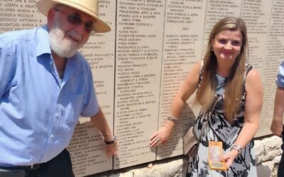 Isidore Zuckerbrod (left) and Renata Szyfner at the Wall of Honor in the Garden of the Righteous Among the Nations at Yad Vashem on May 25, 2022. (Yad Vashem)