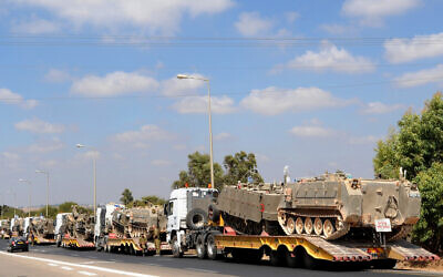 A military convoy carrying APCs near Israel's border with the Gaza Strip, on July 19, 2014. (Gili Yaari/Flash90)