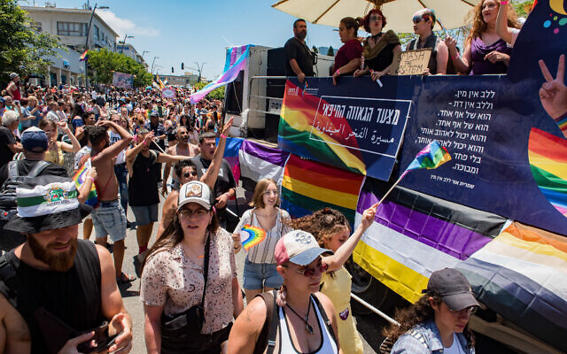 People march during the annual Gay Pride Parade in Haifa, June 18, 2021. (Roni Ofer/Flash90)