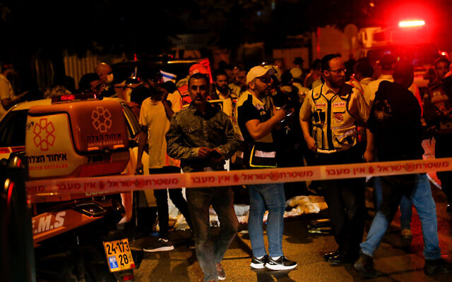 Security and rescue personnel work at the scene of a terror attack, in Elad, May 5, 2022. (Jamal Awad/Flash90)