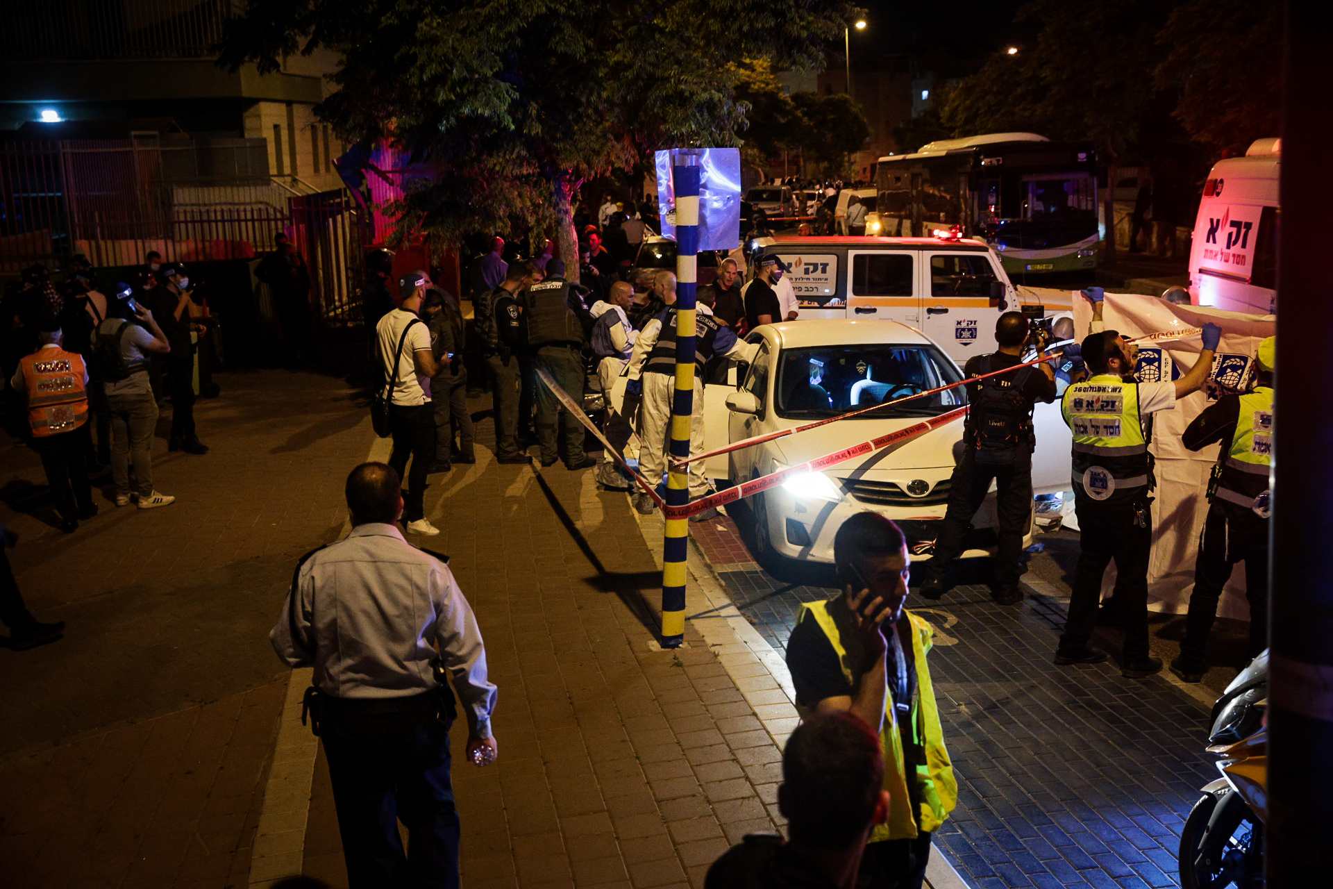 Security and rescue personnel work at the scene of a terror attack, in Elad, May 5, 2022. (Yossi Aloni/Flash90)