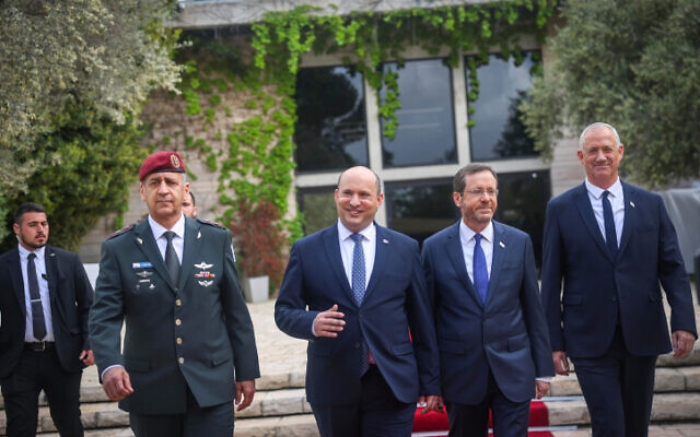 From left: IDF Chief of Staff Aviv Kochavi, Prime Minister Naftali Bennett, President Isaac Herzog and Defense Minister Benny Gantz during an event for outstanding soldiers as part of Israel's 74th  Independence Day celebrations, at the President's Residence in Jerusalem on May 5, 2022. (Yonatan Sindel/Flash90)