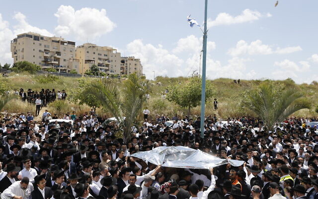Mourners gather at the funeral processions for Yonatan Havakuk and Boaz Gol, a day after they were killed in a stabbing attack in the central Israeli city of Elad, May 6, 2022. (Olivier Fitoussi/Flash90)