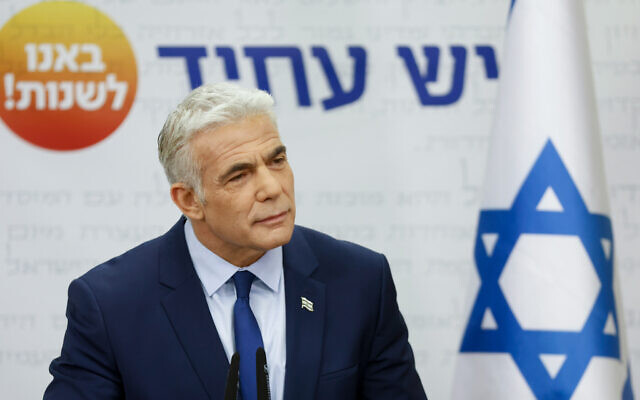 Foreign Minister Yair Lapid speaks during his Yesh Atid faction meeting at the Knesset on May 9, 2022. (Olivier Fitoussi/Flash90)