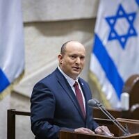 Prime Minister Naftali Bennett speaks to the Knesset plenum in Jerusalem on May 11, 2022. (Olivier Fitoussi/Flash90)