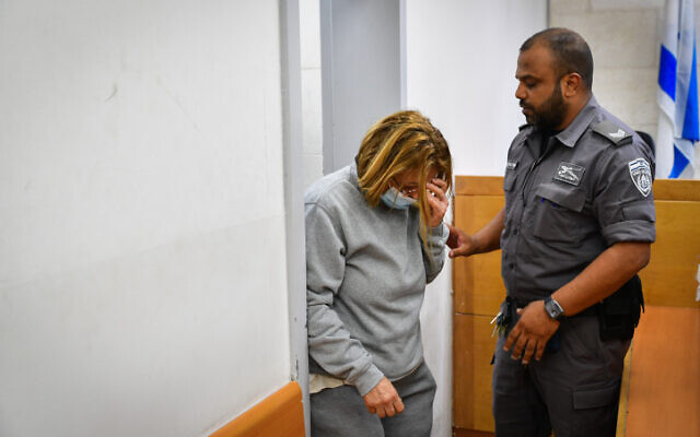 Ilana Sporta Hania, a 65-year-old resident of Ashkelon, suspected of sending envelopes containing bullets to the Bennett family, seen as she arrives for a court hearing at the Rishon LeTsiyon Magistrate's Court, May 12, 2022. (Avshalom Sassoni/Flash90)