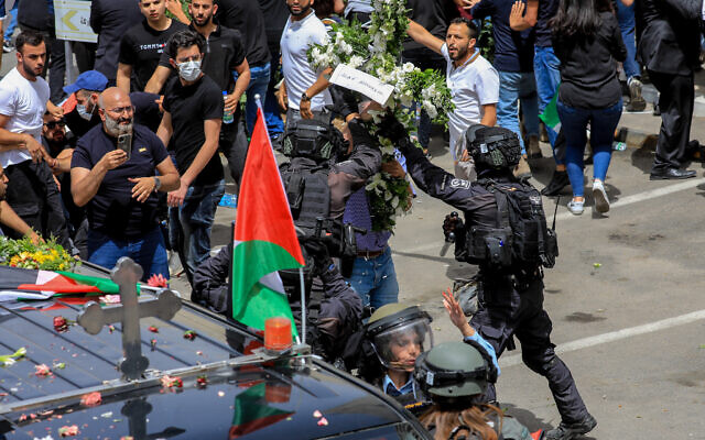 Israel police at the funeral procession of Al Jazeera journalist Shireen Abu Aqleh at St Joseph hospital in Jerusalem, May 13, 2022. (Jamal Awadl/Flash90)