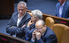 Israeli Prime Minister Naftali Bennett, Minister of Defense Benny Gantz and Minister of Foreign Affairs Yair Lapid attend a plenum session in the assembly hall of the Knesset, the Israeli parliament in Jerusalem on May 16, 2022. (Olivier Fitoussi/FLASH90)
