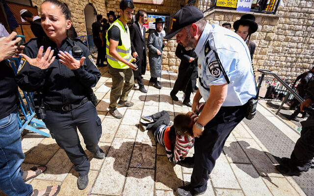 Pilgrims clash with police during Lag B'Omer celebrations, in Meron, on May 19, 2022. (David Cohen/Flash90)