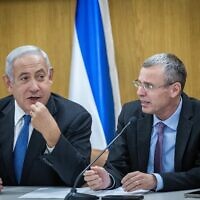 Likud party head Benjamin Netanyahu (L) and faction chair Yariv Levin (R) lead their party's faction meeting at the Knesset, May 23, 2022. (Yonatan Sindel/Flash90)