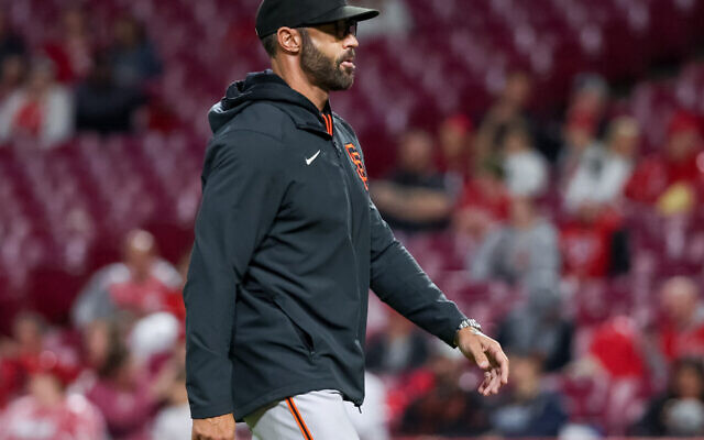San Francisco Giants manager Gabe Kapler walks across the field during a game against the Cincinnati Reds in Cincinnati, Ohio on May 27, 2022. (Dylan Buell/Getty Images)