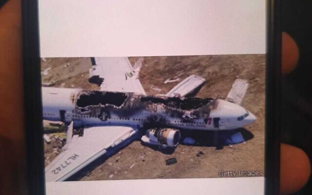 A photo of Asiana Airlines Flight 214, one of several plane crash photos sent to passengers on a flight from Israel to Turkey that was delayed on May 10, 2022 (Israel Airports Authority)