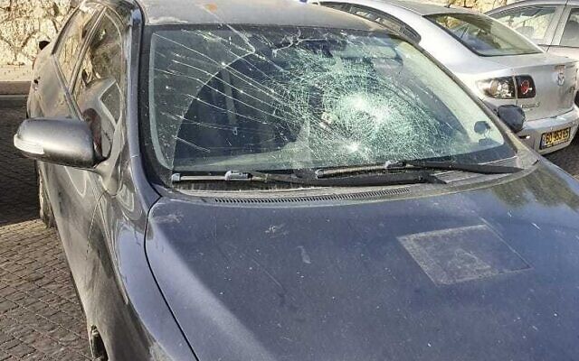 The smashed front window of an Israeli car after a Palestinian allegedly hurled a cinderblock at the vehicle near the West Bank settlement of Beit El, May 13, 2022. (Courtesy)