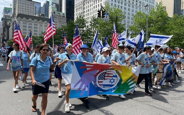 Participants march in the annual Celebrate Israel parade on Fifth Avenue in New York City, on May 22, 2022. (Luke Tress/Times of Israel)