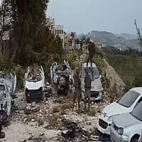 Soldiers damage cars in a scrapyard in the West Bank town of Burqa, on April 15, 2022. (Screenshot : B'Tselem/Twitter)