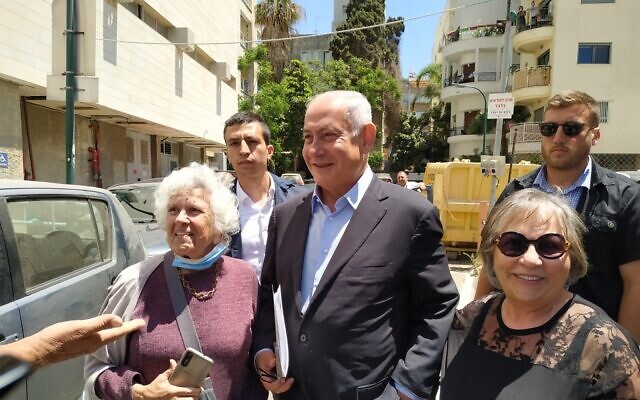 Opposition chairman Benjamin Netanyahu leaves the Likud party headquarters in Tel Aviv on May 8, 2022. (Carrie Keller-Lynn/Times of Israel)