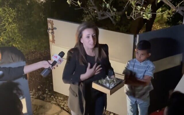 Meretz MK Ghaida Rinawie Zoabi speaks to protesters and reporters outside her home in Nof Hagalil on May 21, 2022. (Screen capture: Twitter)