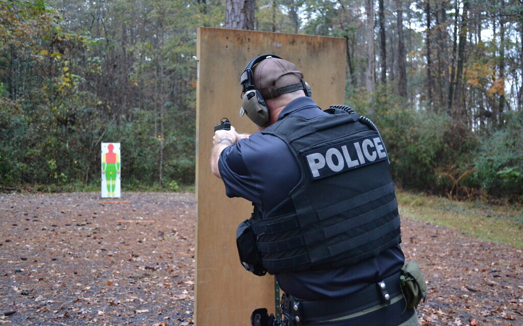 A member of the LaGrange police department practices Shoot to Incapacitate techniques at the shooting range in early 2022. (Katja Ridderbusch)
