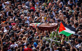 People carry the coffin of Al Jazeera journalist Shireen Abu Akleh in Jerusalem, May 13, 2022. (Yonatan Sindel/Flash90)