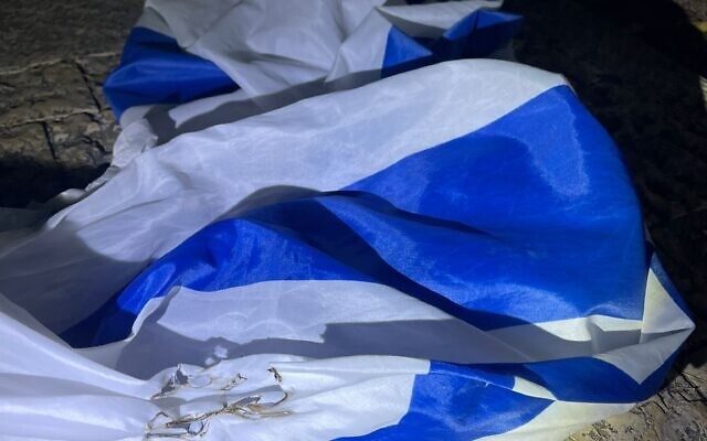 An Israeli flag that police say a pair of Haifa residents tried to burn on May 3, 2022. (Israel Police)