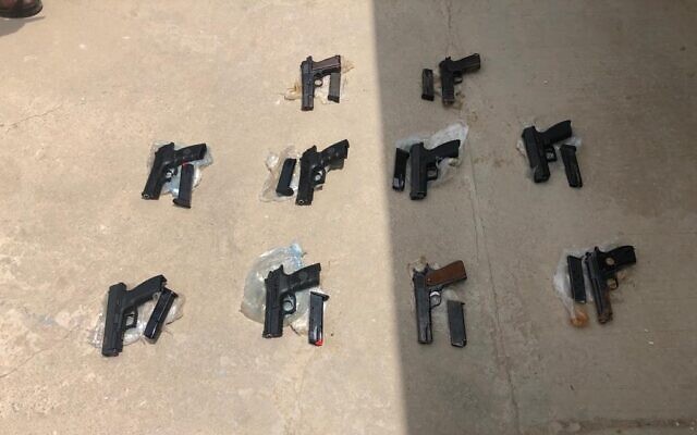Weapons seized by security forces near al-Auja in the West Bank, after an alleged gun-smuggling over the border with Jordan on May 2, 2022. (Israel Police)