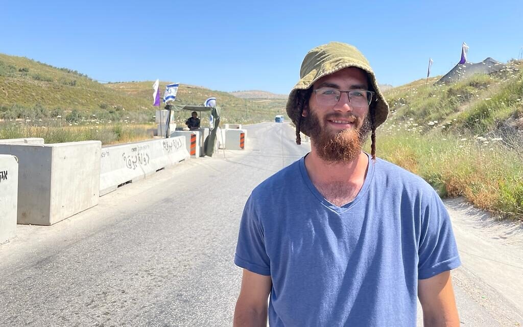 Yeshiva student Asher Katzman at a checkpoint blocking the road to Homesh, May 26, 2022. (Carrie Keller-Lynn/The Times of Israel)