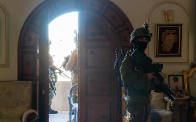 Israeli troops are seen operating in the home of a Palestinian terrorist in the West Bank town of Rummanah, May 8, 2022. (Israel Defense Forces)