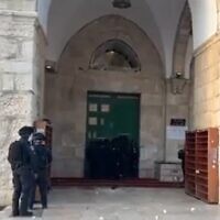 Police officers outside the Al-Aqsa Mosque in Jerusalem on May 29, 2022 (Screen grab)