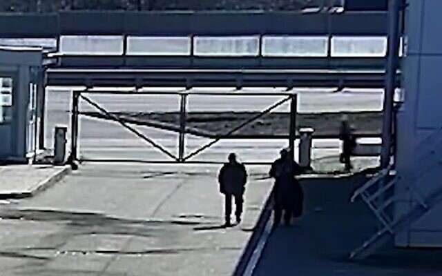 Surveillance footage published by CNN shows Russian soldiers shooting two civilians in the back on March 16, 2022, on the outskirts of Kyiv. (Screenshot)