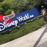 Protesters wave swastika flags outside of Disney World in Florida on May 7, 2022 (Screen capture/Twitter)