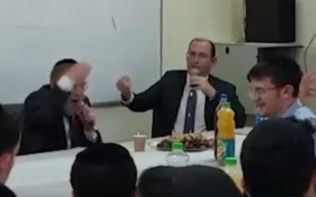 United Torah Judaism MK Yitzhak Pindros (left) speaks during a panel held for Israel's 74th Independence Day at the Nehora high school yeshiva in the West Bank. Alongside him is Religious Zionism party MK Simcha Rothman, May 5, 2022. (Screenshot/Twitter)
